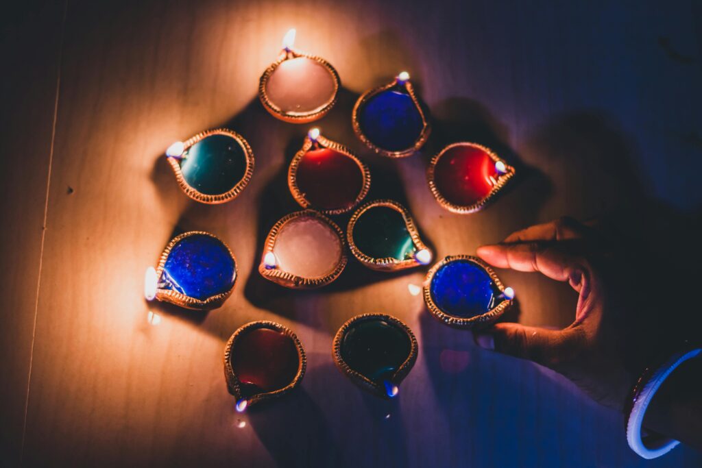 Vibrant diyas arranged creatively for Diwali, creating a warm, festive ambiance.